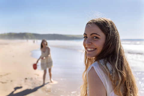 Portrait of happy teenage girl on the beach stock photo