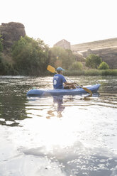 Spain, Segovia, Man in a canoe in Las Hoces del Rio Duraton - ABZF001190