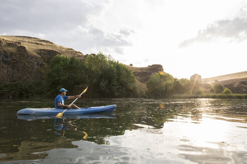 Spain, Segovia, Man in a canoe in Las Hoces del Rio Duraton - ABZF001191
