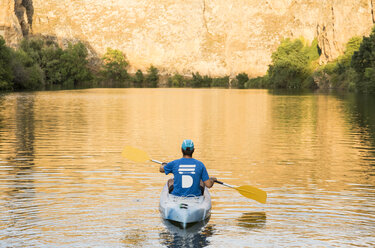 Spain, Segovia, Man in a canoe in Las Hoces del Rio Duraton - ABZF001195