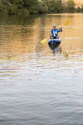 Spain, Segovia, Man in a canoe in Las Hoces del Rio Duraton - ABZF001200