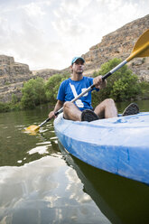 Spain, Segovia, Man in a canoe in Las Hoces del Rio Duraton - ABZF001202
