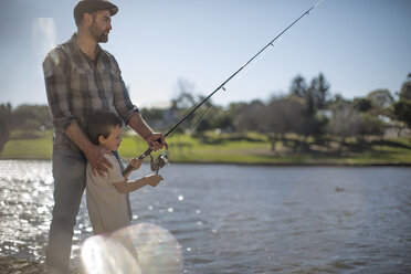 Father and son fishing together - ZEF010215