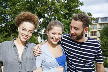 Three happy friends outdoors - WESTF021749