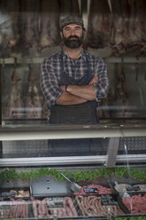 Portrait of confident butcher in butchery - ZEF010290