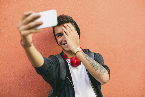 Teenager, smiling, selfie, smartphone stock photo