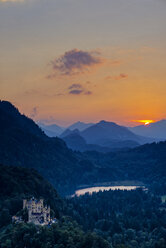 Germany, Bavaria, Allgaeu, Hohenschwangau Castle and Lake Alpsee at sunset - WG00957