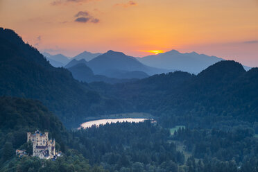 Germany, Bavaria, Allgaeu, Hohenschwangau Castle and Lake Alpsee at sunset - WG00958