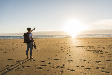 France, Bretagne, Finistere, Crozon peninsula, woman during beach hiking stock photo