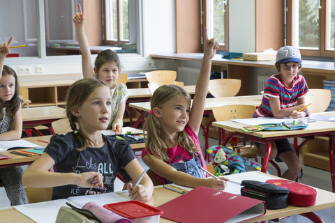 Active pupils at classroom stock photo