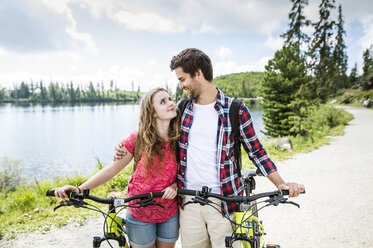 Young couple doing a bicycle trip - HAPF00851
