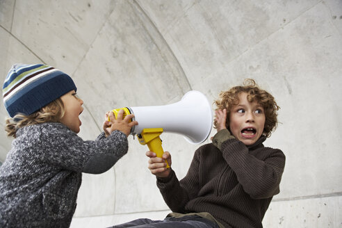 Two brothers playing with a megaphone - FSF00462