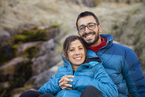 Spain, Sierra de Gredos, happy couple resting in the mountains stock photo
