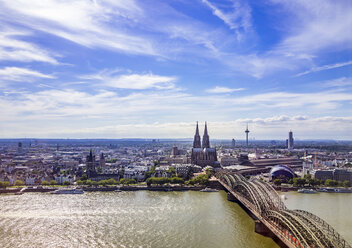 Germany, Cologne, view to the city with Hohenzollern Bridge and Rhine River in the foreground from above - KRPF01838