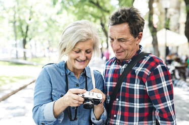 Senior couple looking at camera - HAPF00944