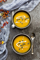 Creamed pumpkin soup in black bowl - SARF02912