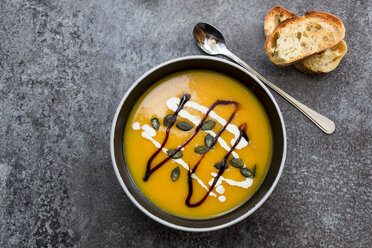 Creamed pumpkin soup in black bowl - SARF02917