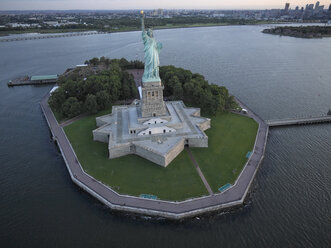 USA, New York City, Aerial photograph of the Statue of Liberty at sunrise - BCDF00038