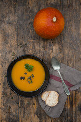 Organic pumpkin soup in black bowl - LVF05358