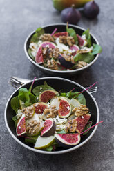 Bowls of baby chard salad with pear, figs, walnuts and feta - SARF02930