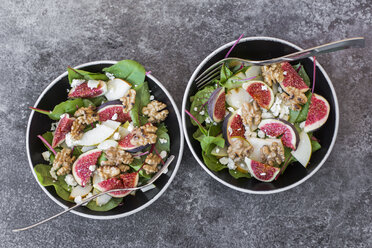 Two bowls of baby chard salad with pear, figs, walnuts and feta - SARF02931