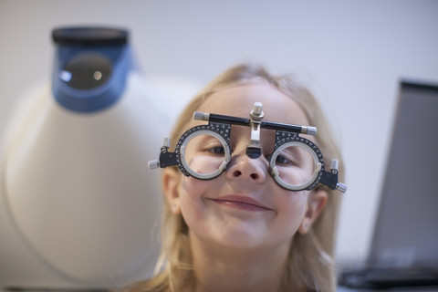 Little girl doing eye test stock photo