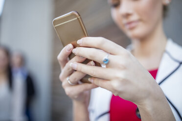 Close-up of woman holding cell phone - ZEF10488