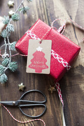 Christmas decoration and wrapped present on wood - SARF02946