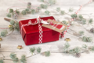 Christmas decoration and wrapped present on wood - SARF02953