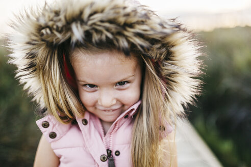 Portrait of smiling little girl with hood - JRFF00876