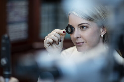 Patient at optometrist trying different lenses - ZEF10565