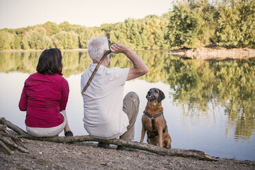 Senior couple with dog at a lake - ONF01035