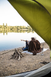 Senior couple camping at a lake - ONF01087