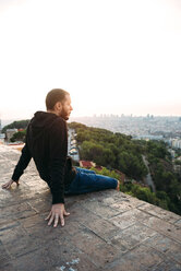 Spain, Barcelona, Man enjoying view over city - GEMF01127