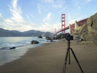 Camera on tripod and Golden Gate Bridge, California, USA - STCF00283