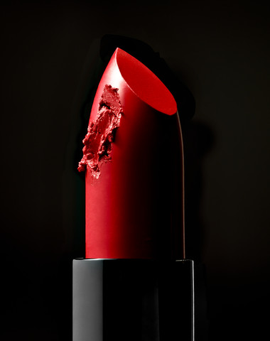 Roter Lippenstift mit einem Kratzer, lizenzfreies Stockfoto