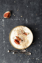 Bowl of natural yoghurt with fig, puffed quinoa and sunflower seed - MYF01802