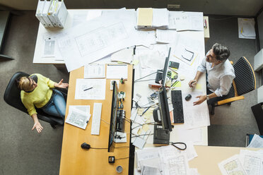 Male and female architects working in office, view from above - TCF05136
