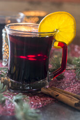 Glass of mulled wine decorated with orange slice - SARF02984