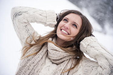 Young woman having fun in snow - HHF05421