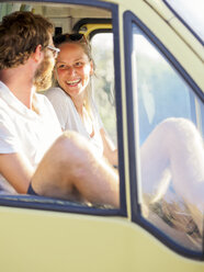 Happy couple traveling in a camper - LAF01767