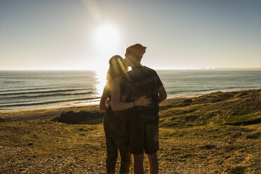 Back view of young couple at seaside at seaside - UUF08772