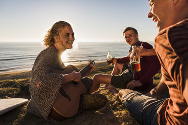 Three friends having fun at seaside - UUF08794