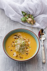 Bowl of sweet potato coconut soup with ginger, parsnip, leek, sprout and almond - SARF02995