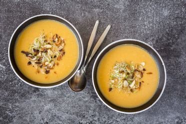 Bowl of sweet potato coconut soup with ginger, parsnip, leek, sprout and almond - SARF02997