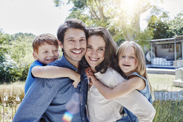 Portrait of happy family in garden - RORF00324