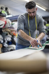 Tailor at work in workshop - ZEF10668