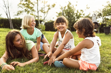 Four girls having fun together on a meadow - MGOF02533