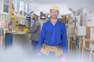 Electrician training, student with hardhat and toolbelt - ZEF10903