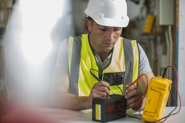 Electrician working with voltmeter - ZEF10914